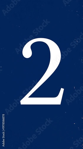 Gold Glitter Blow‑Away Reveal of Number 2 on Solid Background