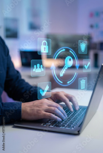 A professional using a laptop with digital cybersecurity icons representing data protection and encryption.