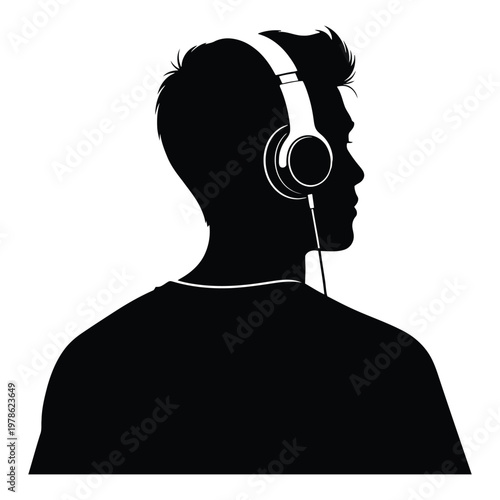 Silhouette of a young man wearing headphones, enjoying music with a sense of focus and immersion