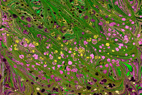 Colorful abstract Ebru marbling background with vibrant liquid ink swirls