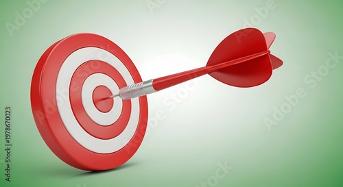Red dart hitting the bullseye on a circular target board, conceptual of success and accuracy.