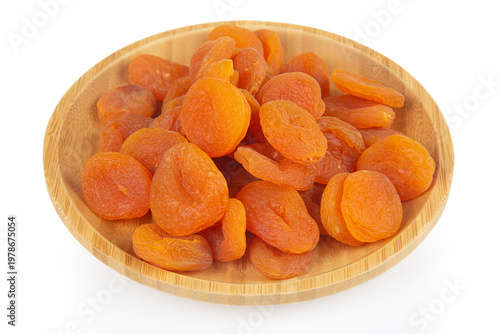 A stack of dried apricots against a white background 