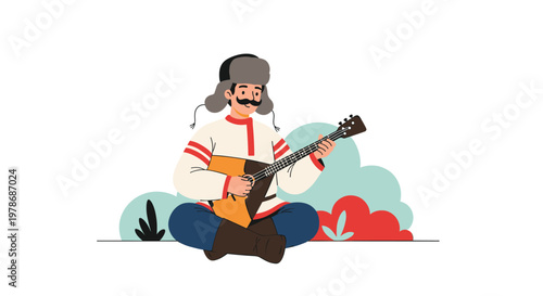 Russian man in a colorful folk costume and winter ushanka hat sits on the ground while playing a traditional three stringed balalaika instrument.