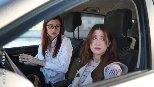 Driving lesson turns chaotic as instructor angrily throws papers out of car after repeated mistakes student freezes under pressure tense moment of frustration and failed practice
