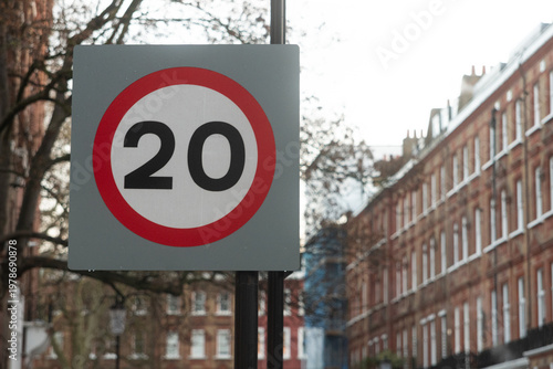 20 mph speed limit road sign on residential street in London