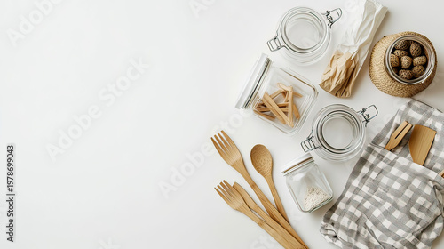 Zero waste lifestyle flat lay with reusable glass jars bamboo products on white background
