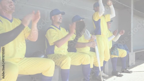 Vertical video: Baseball team shifting in dugout after big hit, passing gloves and bat, celebrating
