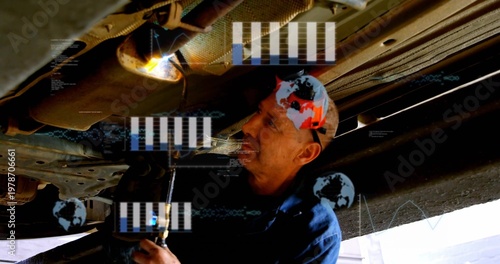 Inspecting mechanic in blue shirt fixing underbody of lifted car in garage with wrench and HUD