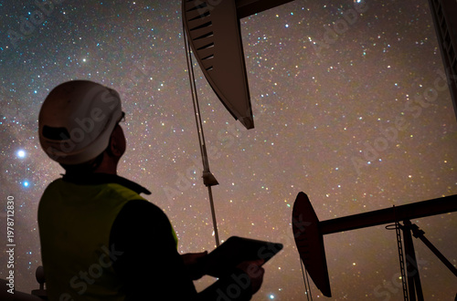 Construction engineer wearing safety vest and oil industry pumps