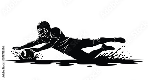American football player diving to catch ball in black silhouette