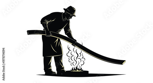 Black silhouette of a man bending over a curved piece of metal being heated over a flame