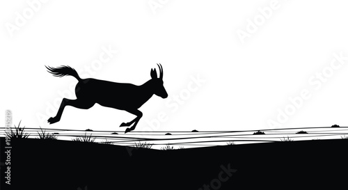 Black silhouette of an antelope running in a natural landscape with grass and hills