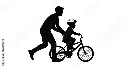 A father helps his young child learn to ride a bicycle outdoors