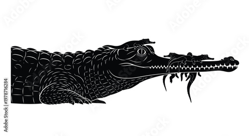 Black silhouette of a crocodile head with open mouth