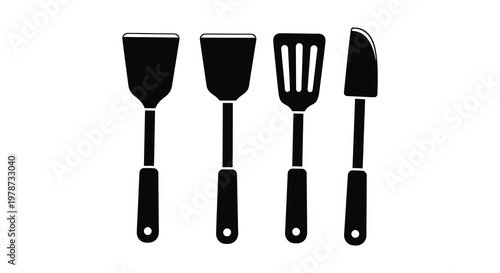 A collection of four black kitchen utensils including spatulas and a turner shown as a silhouette high quality