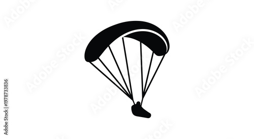 A stark black silhouette of a paraglider soaring through the air capturing a sense of freedom and flight silhouette