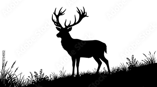 Deer with large antlers standing still.