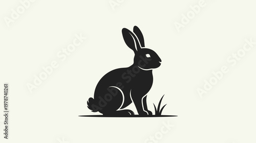 Black silhouette of a rabbit sitting.