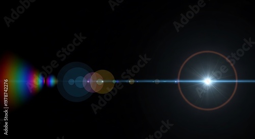 Optical lens flare effect with rainbow and light streaks against black background