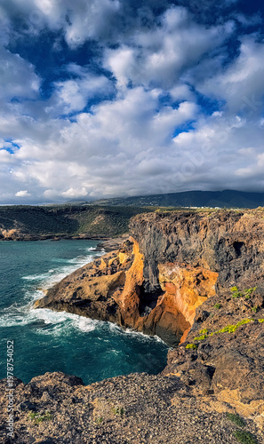 Colorful volcanic cliffs and turquoise ocean in La Caleta Tenerife Canary Islands
