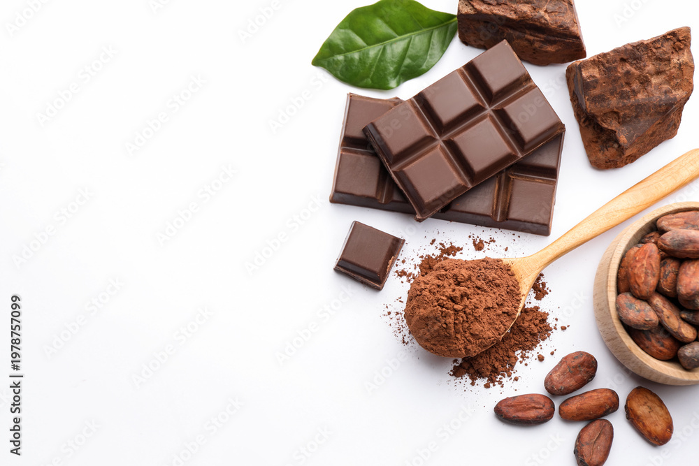 Fototapeta premium Cocoa powder, beans, chunks, pieces of chocolate and green leaf on white background, flat lay. Space for text