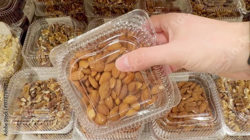 Choosing a variety of nuts at the supermarket