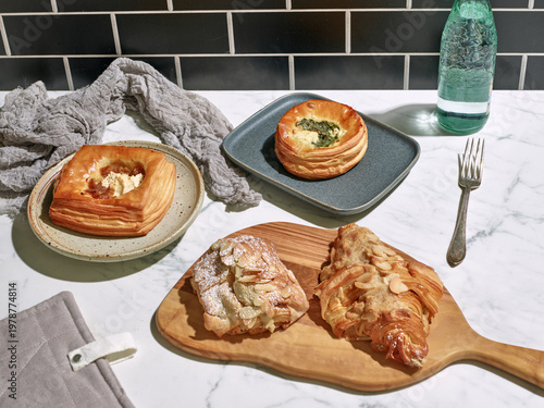Sweet and savory French pastries sitting on white marble table