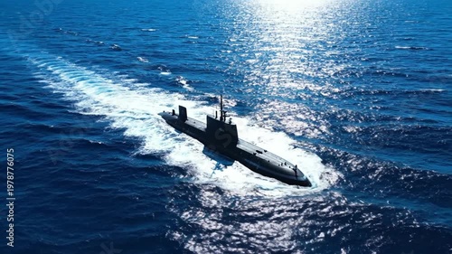 A submarine navigates through the ocean waves under the sunlight.