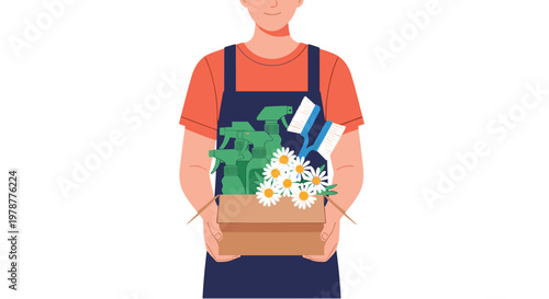Friendly professional cleaner wearing a blue apron holds a cardboard box filled with green spray bottles and fresh white daisies against a white background.