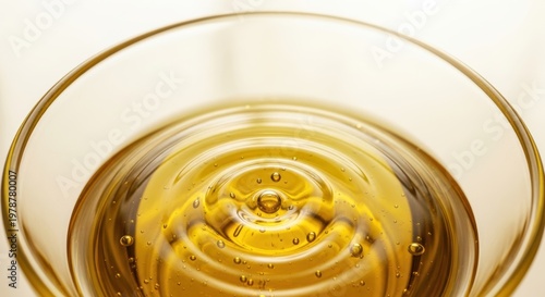 Golden Liquid Surface with Circular Ripples and Reflections.