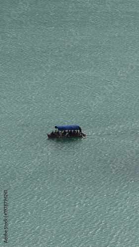 boat in the water lake bled slovenia (european travel tourism destination) castle island rent hire attraction beautiful julian alps clean water