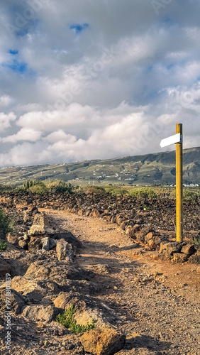 Coastal path with hikers and ocean view in La Caleta Tenerife Canary Islands