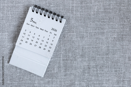Desk calendar for May 2026 on a gray background with copy space.