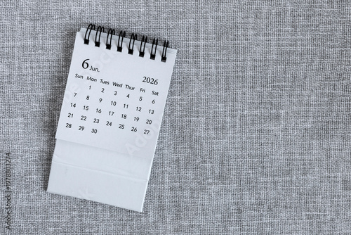 Desk calendar for June 2026 on a gray background with copy space.