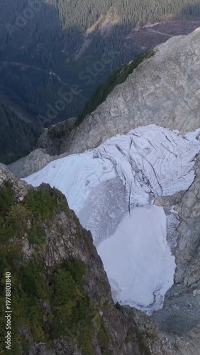 Aerial View Of A Vast Glacier With Deep Crevasses In The Majestic Mountains Of British Columbia, Canada