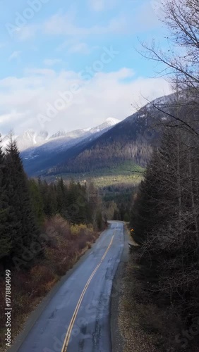 Scenic Mountain Road Winding Through Forest in British Columbia, Canada