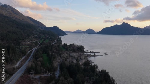 Aerial View of Scenic Howe Sound in British Columbia, Canada at Sunset with Mountain and Coastal Road