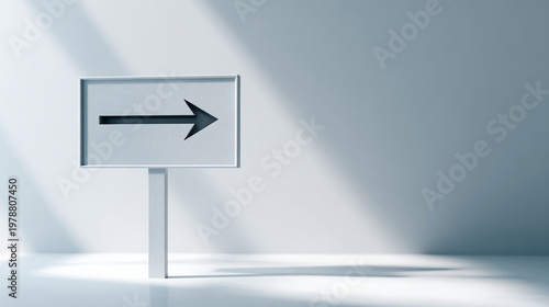 A minimalist sign featuring an arrow pointing right, casting shadows in a softly lit environment.