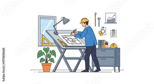Professional architect in a hard hat working on a floor plan at a drafting table in a well-equipped design studio workspace.
