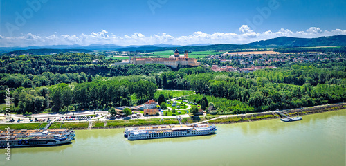 Melk abbey on Danube river in front of the foothills of the Alps on the horizon in the Wachau region in Upper Austria, Austria