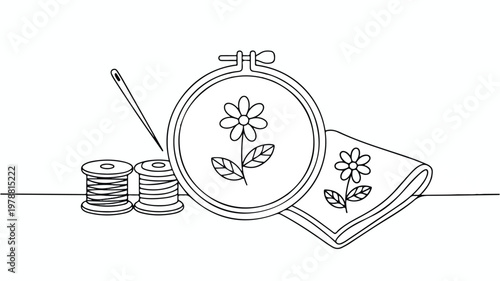 Line drawing of embroidery hoop with flower design and sewing supplies