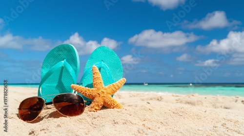 Summer Day at the Beach With Sandals and Sunglasses on the Sand Near Calm Blu...