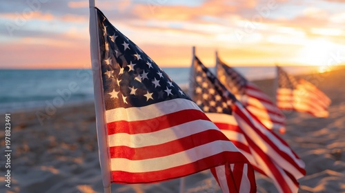 Flags Wave on the Beach as the Sun Sets Over the Ocean in the Evening Sky