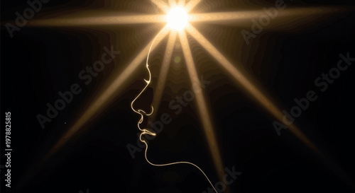 Profile view of a human head silhouette illuminated by a glowing golden light emanating from the crown area symbolizing spiritual awakening and inner mental peace