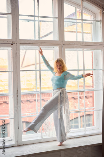Free Download Cheerful individual practicing stability and movement indoors - GFXLoad