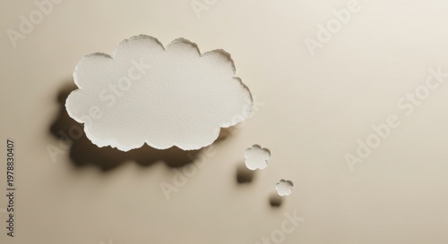Thought bubble torn from paper on neutral background representing communication idea brainstorming and social media speech cloud concepts 