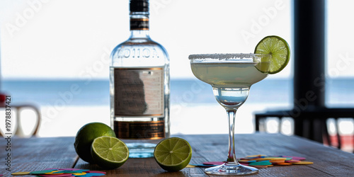 Tequila cocktail glass with lime slice photo, alcoholic drink bar beverage concept on table background
