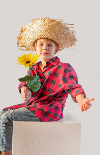 Caucasian child dressed for the June fiestas in Brazil, isolated on a light background