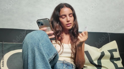 Young woman making online purchase with credit card
