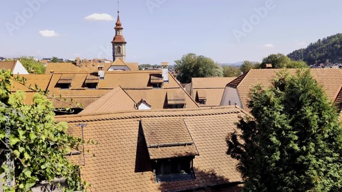 beautiful view of historic european village with red rooftops and tall church tower in slovenia, europe (travel tourism destination)